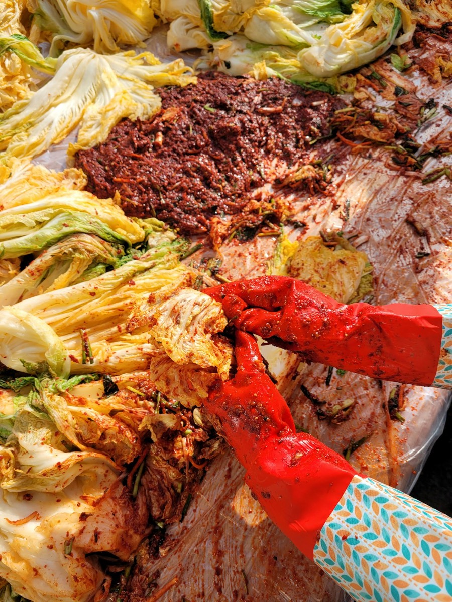 Korean banchan side dishes in metal bowls - cooking class experience in South Korea