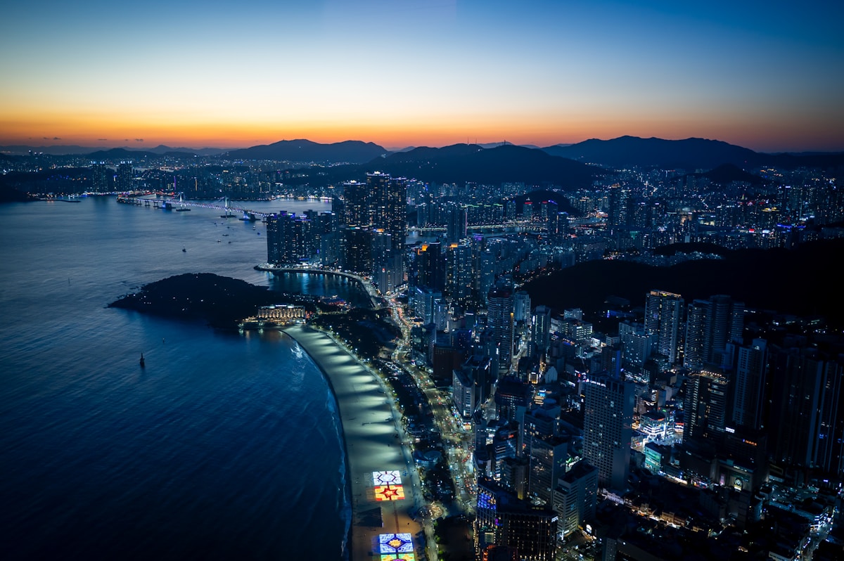 Haeundae Beach in Busan with hotels along the shoreline at sunset