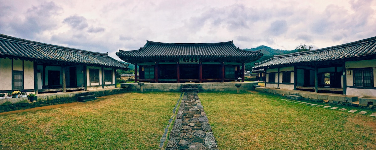 Grassy royal burial mounds in Gyeongju's Daereungwon Tumuli Park at dusk