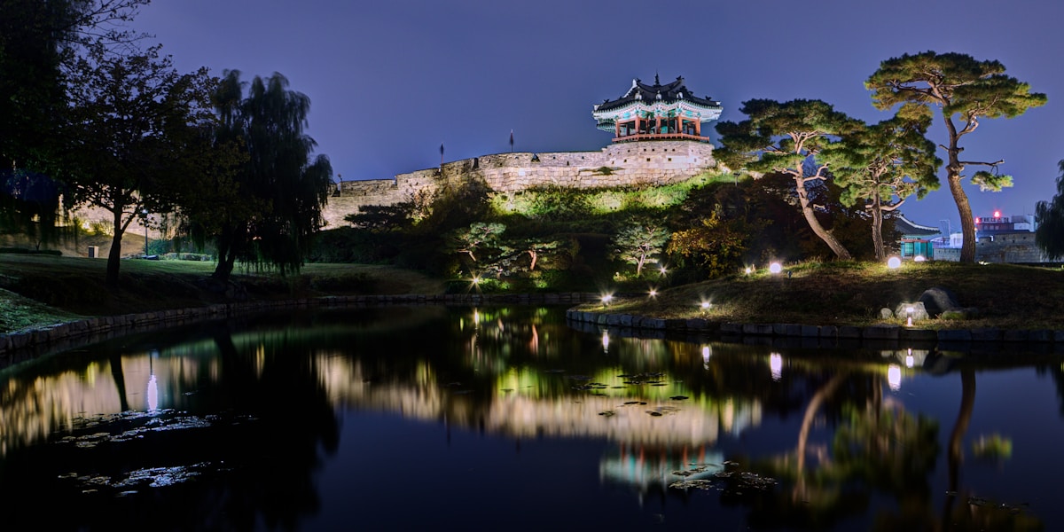 Hwaseong Fortress gate tower and stone walls in Suwon on a clear afternoon