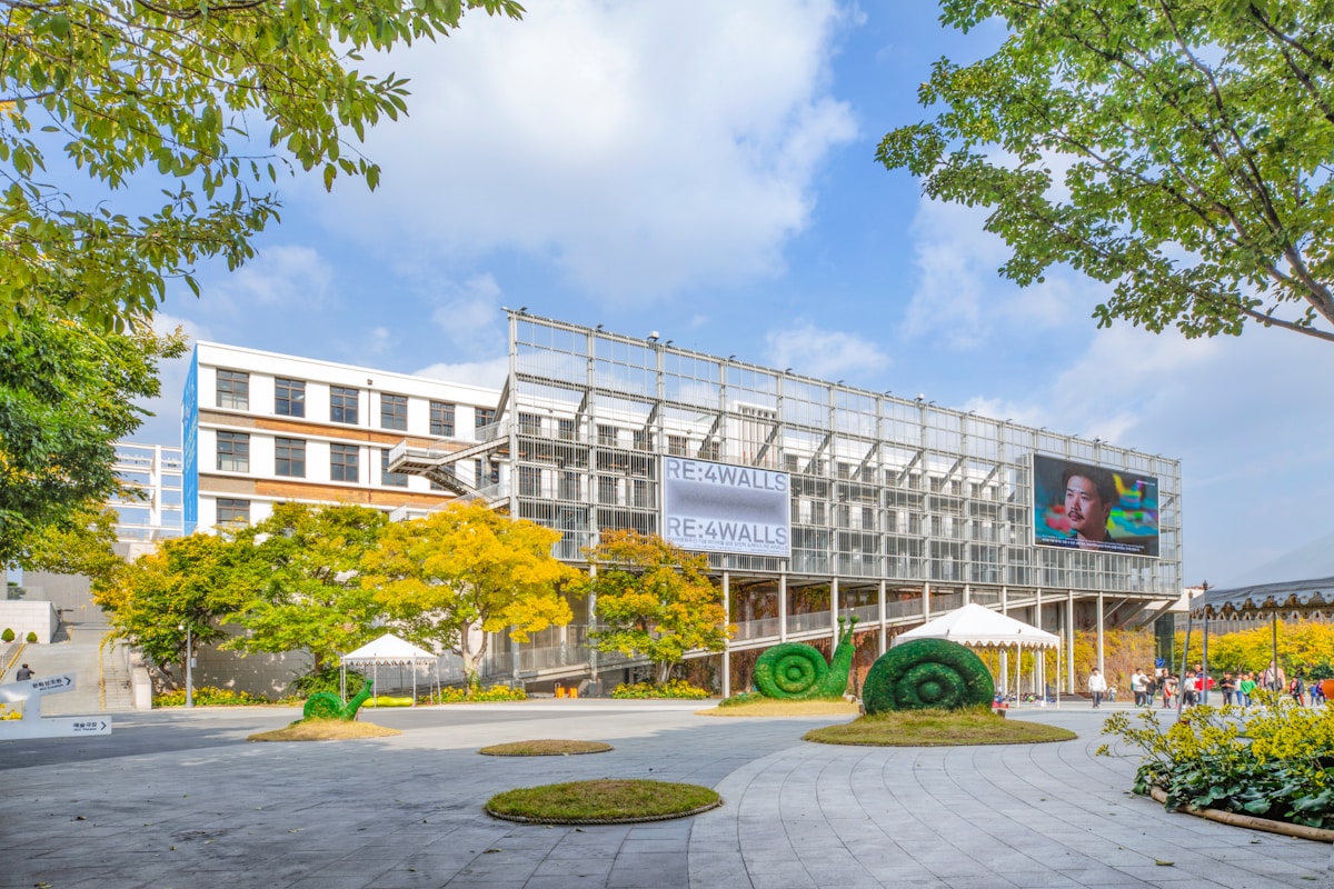 Contemporary arts and cultural centre with open courtyard surrounded by autumn trees, Gwangju, South Korea