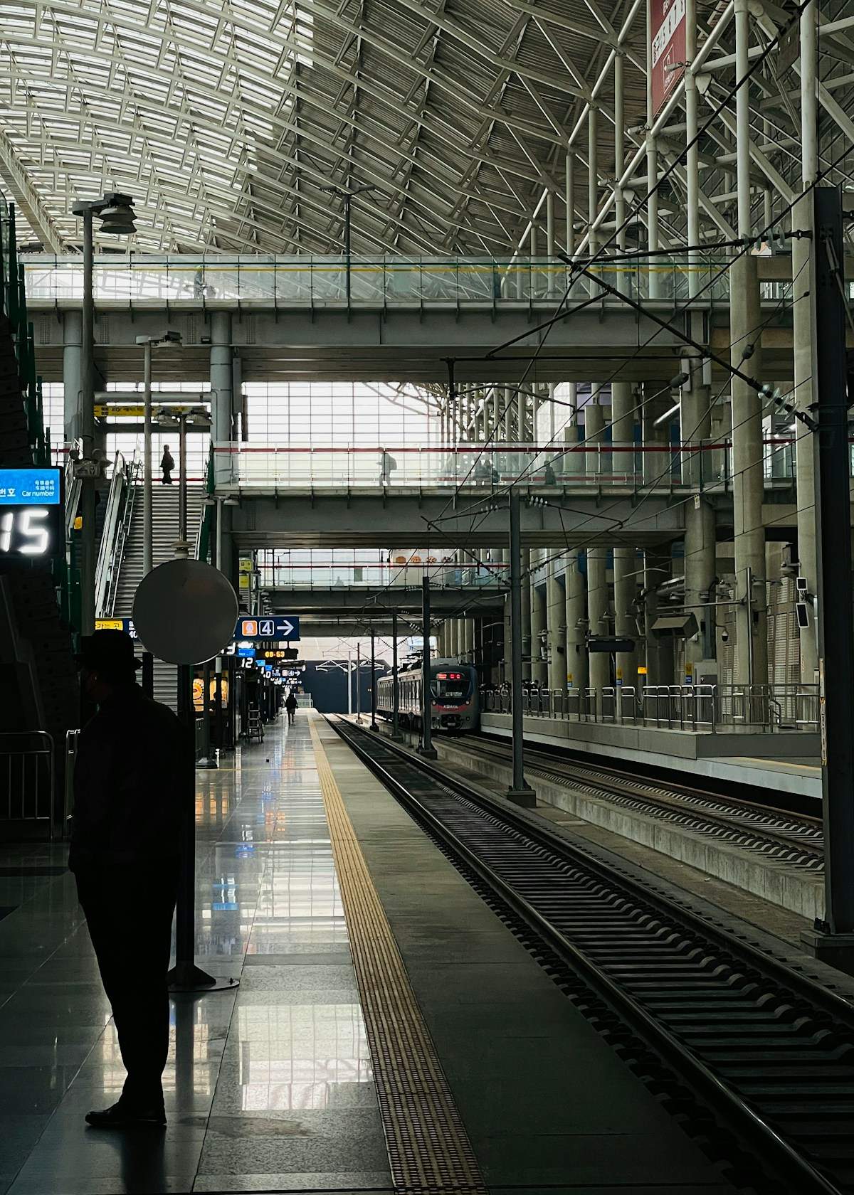Train station platform with a train on the tracks in South Korea