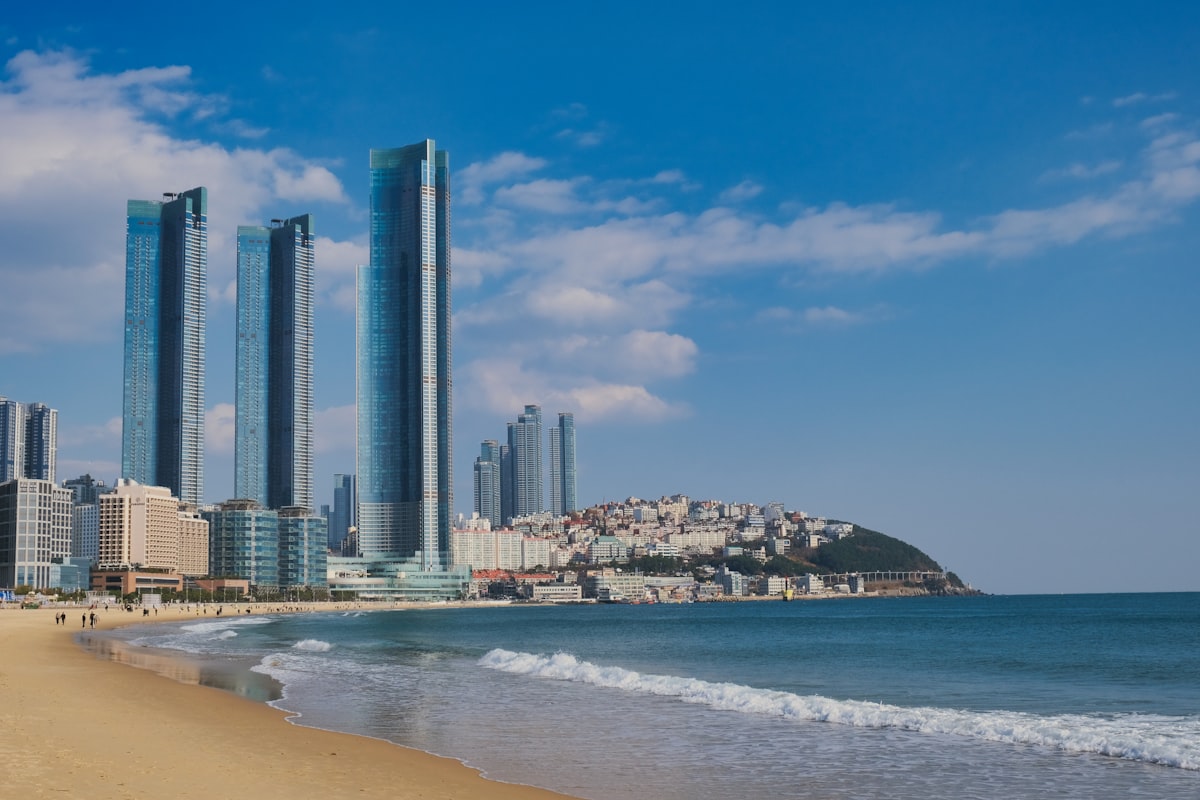 Haeundae Beach in Busan with glass skyscrapers and calm blue sea, South Korea