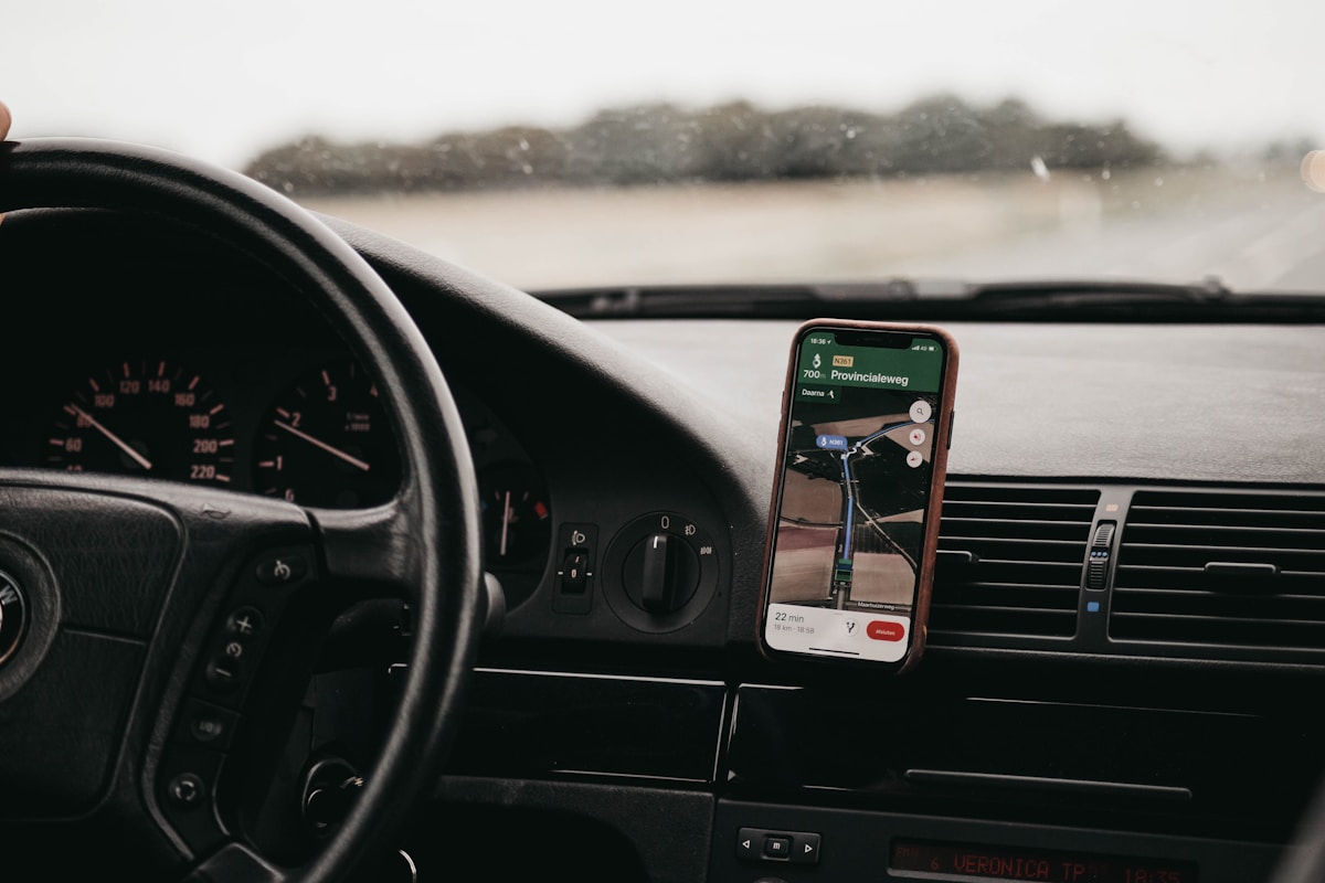 Smartphone in a car dashboard mount showing a navigation app - essential apps for travelling South Korea