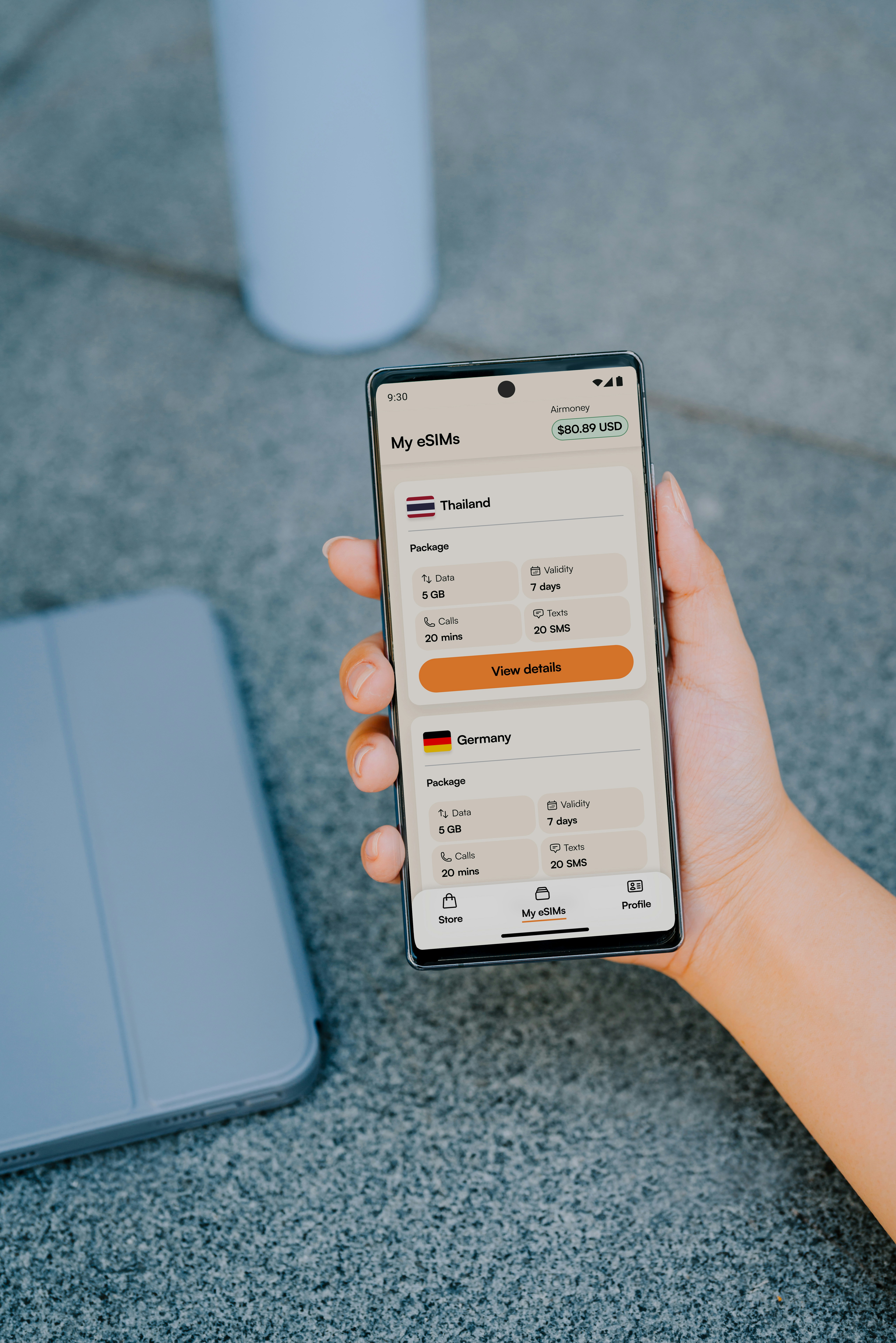 Hand holding smartphone displaying eSIM options for travel — Korea SIM card and eSIM guide