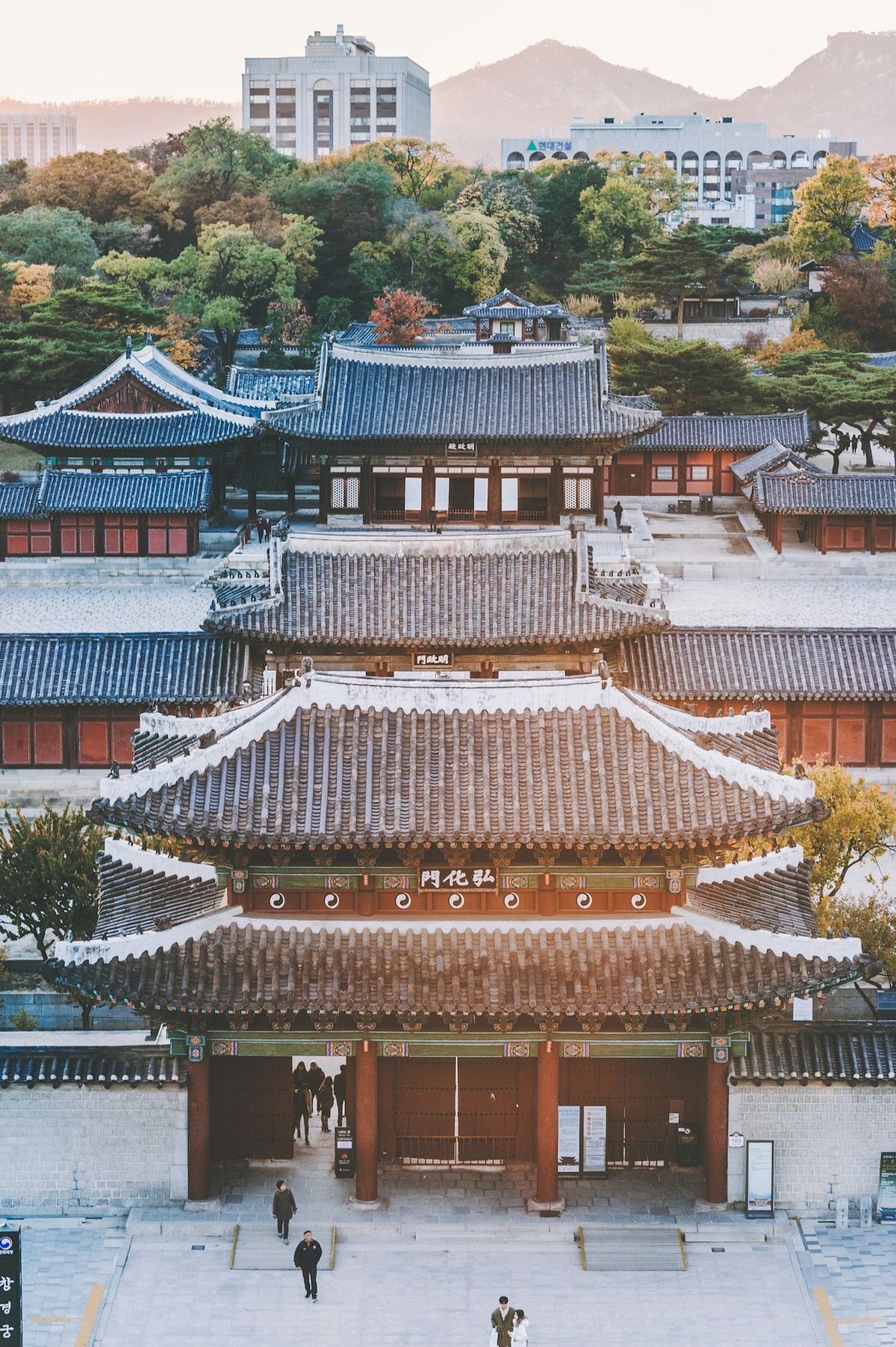 Traditional Korean palace buildings with tiled roofs and lanterns, Seoul, South Korea
