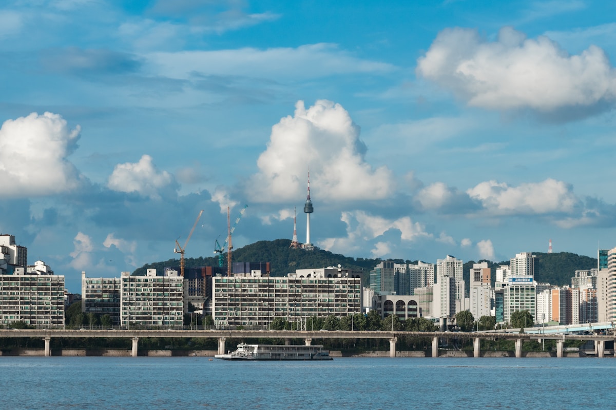 Seoul city skyline with Gyeongbok Palace and modern towers representing South Korea