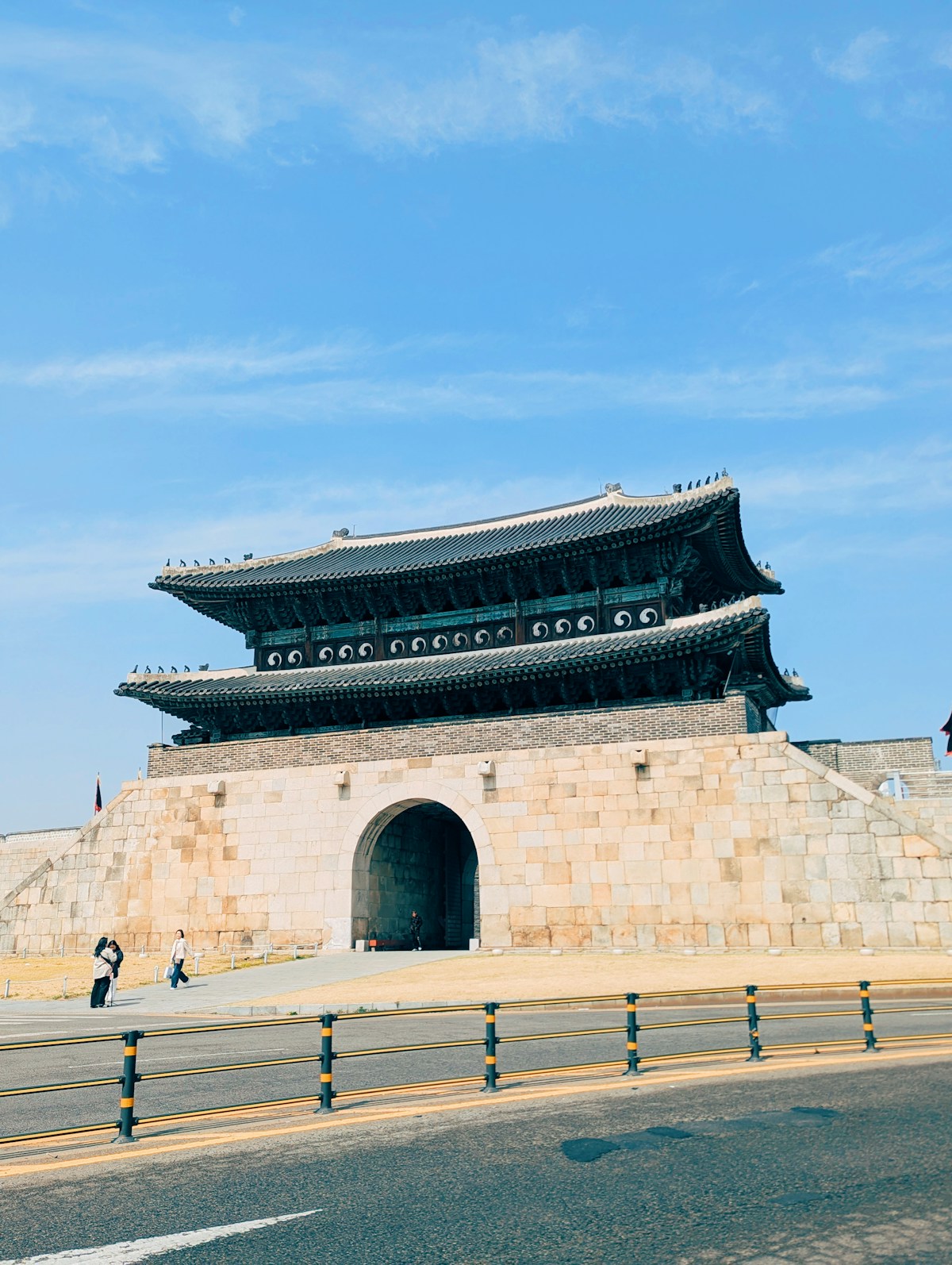 Traditional Korean fortress gate under clear blue sky at Hwaseong, Suwon, South Korea