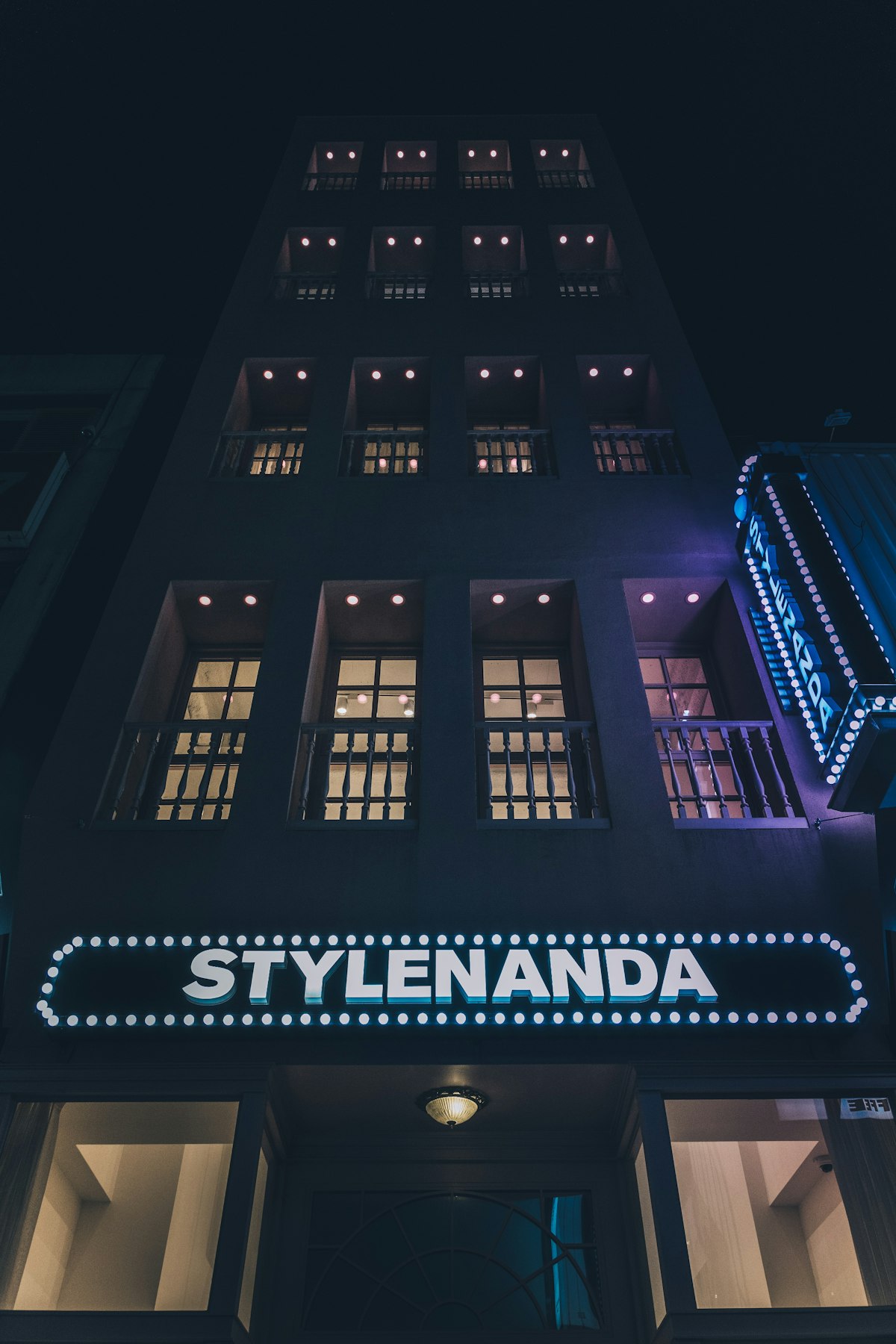 Stylenanda flagship store lit up at night in Myeongdong, Seoul