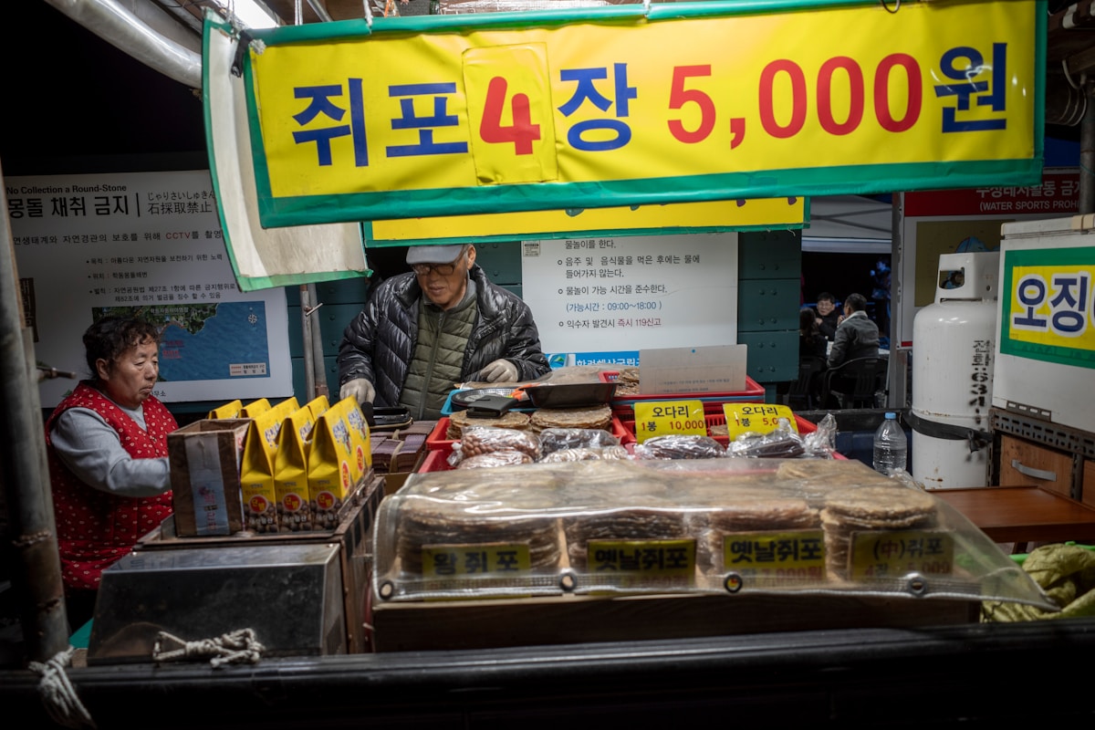 Street food stall with Korean text and food displayed in South Korea