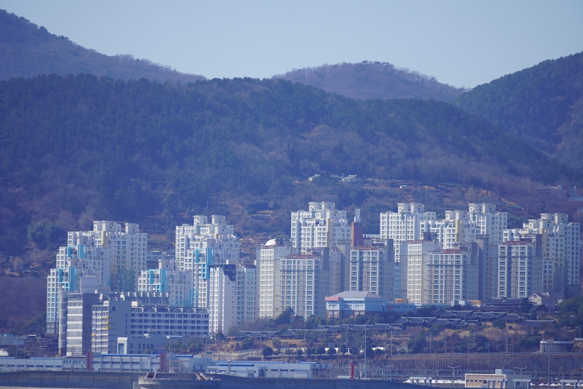 Yeosu night sea panorama with city lights reflecting on the calm harbour and distant islands, South Korea